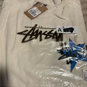 Stussy Cream Tee with Black and Blue Logo